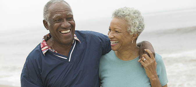 Senior Couple Relaxing In Autumn Landscape